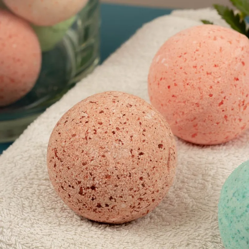 Close-up of a bath bomb showing its crumbly, moisture-sensitive surface