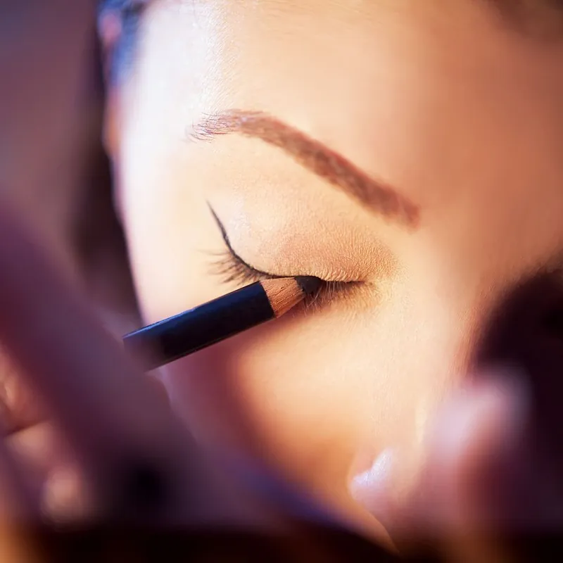 Close-up of eyeliner being applied, the product custom eyeliner boxes protect