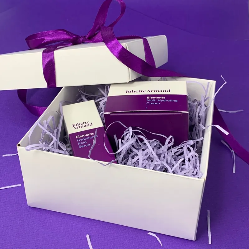 Premium rigid gift box with branded skincare product boxes inside